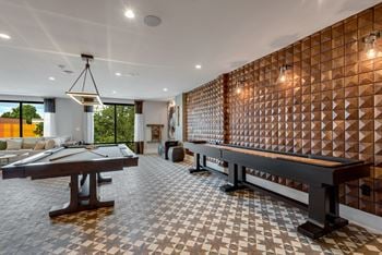 Game room with billiards table and games